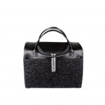 Yorkie with black tie party carrier